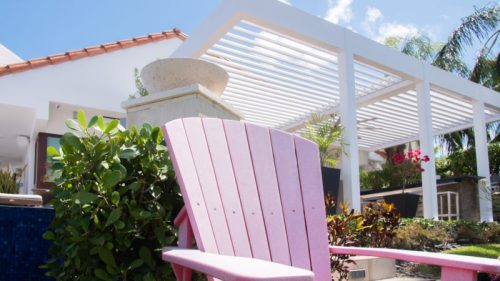 white pergola with 2 louvered roof structure