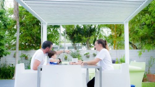 outdoor deck with motorized louvered pergola - hurricane zone