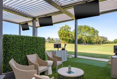 Custom commercial pergola system for golf court with integratedTVs by Azenco