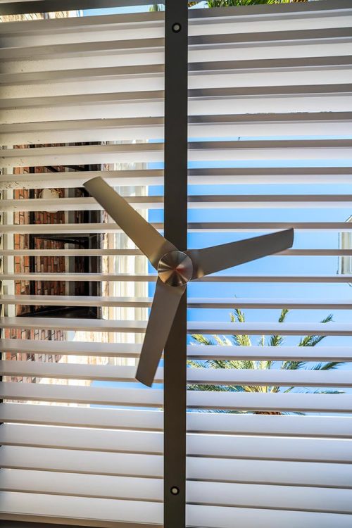 Detail of open louvered roof pergola R-BLADE with fan by Azenco Outdoor