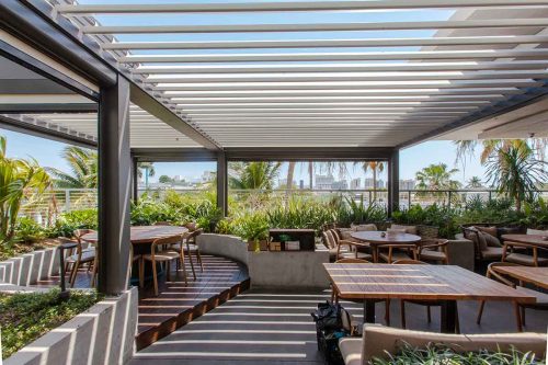 Rooftop terrace pergola. Model R-BLADE with motorized louvered roof by Azenco Outdoor