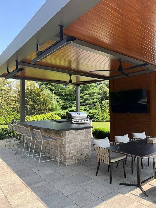 Wood grain finish aluminum pergola with insulalted roof: R-SHADE by Azenco