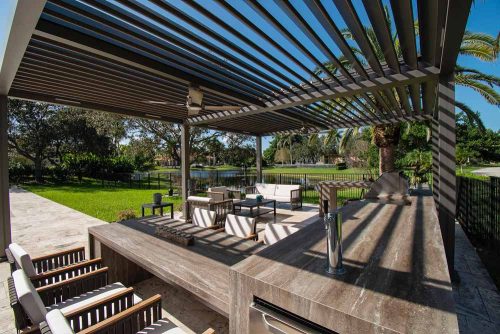 Freestanding motorized louvered pergola in black - R-BLADE motorized louevred roof by Azenco Outdoor