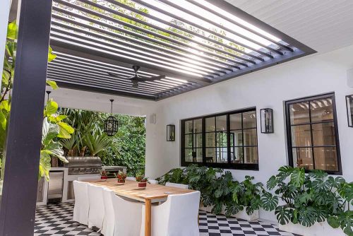 Louvered roof insert in black: custom R-BLADE pergola