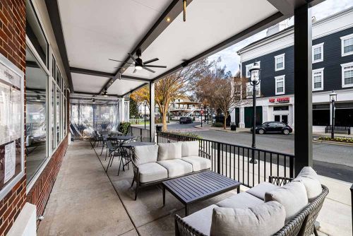 Custom designed pergola with fan to cover a bar terrace - R-SHADE by Azenco Outdoor