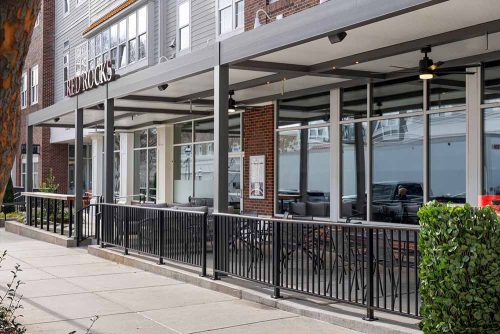 covered outdoor sitting space - R-SHADE custom insulated pergola by Azenco