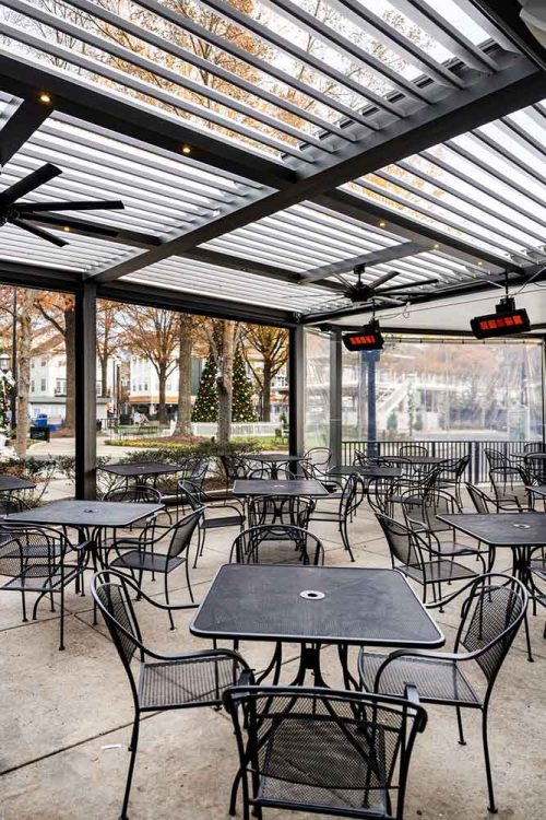 All-seaosn commerical outdoor space with motorized louvered pergola, fan and heaters - Azenco Outdoor