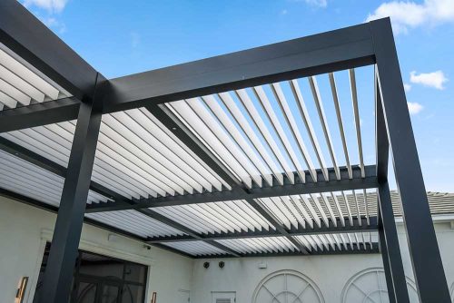 Black and white louvered roof details: Azenco commercial pergola