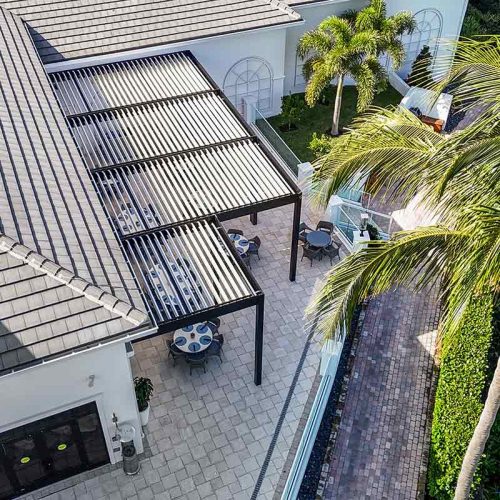 Aerial view of motorized louvered roof pergola on restaurant rooftop terrace - Azenco