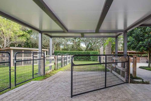 Horse shaded aoutdoor space: R-SHADE insulated roof by Azenco