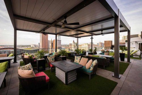 outdoor sitting space covered by R-BLADE louvered roof pergola