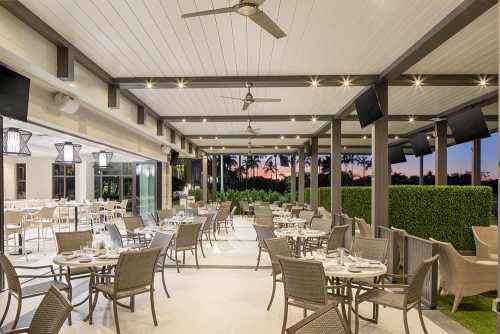 Closed louvered roof pergola at night with LED lights - Azenco Pergola