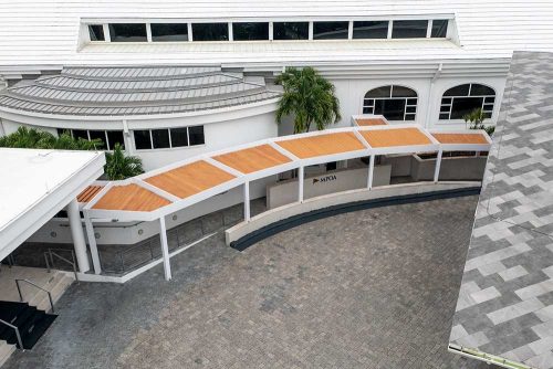 Hotel covered pathway with Azenco pergola