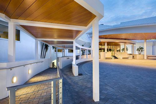 Hotel covered pathway at night - Azenco Outdoor