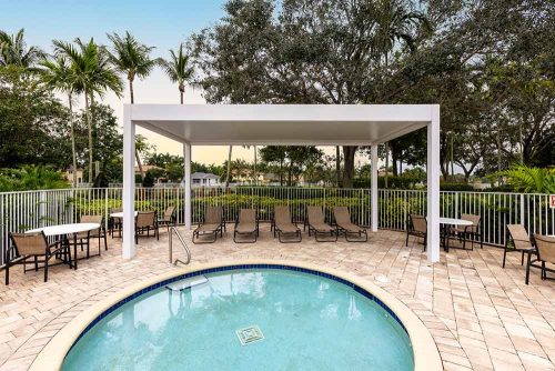Community pool deck with insualted roof pergola - R-SHADE by Azenco Outdoor