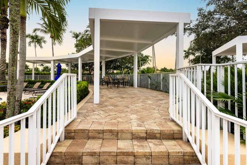 Shaded pathway for a community pool - R-SHADE pergola by Azenco