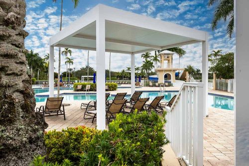 Custom R-SHADE patio cover for a community pool - Azenco Outdoor