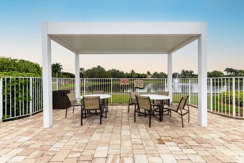 Community pool pergola with aluminum insulated roof: R-SHADE patio cover by Azenco