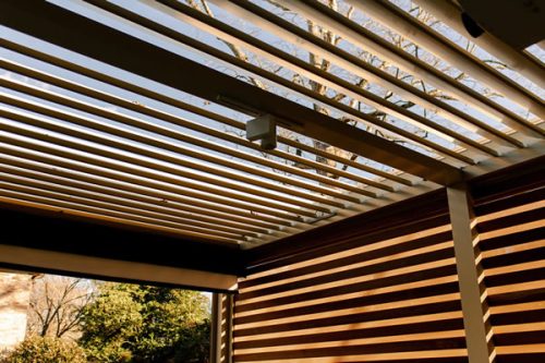 louvered walls and roof - aluminum pegola with wood graon finish- Azenco