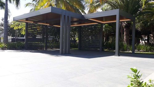 Modern Aluminum R-Car car port for luxury cars and golf carts - colors are bronze for the structure and wood grain finish for the insulated roof - Azenco