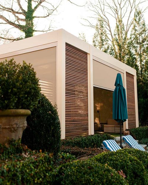 Custom motorized pergola by Azenco - Home golf simulation clubhouse