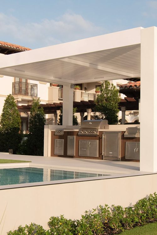 White pergola outdoor space with kitchen